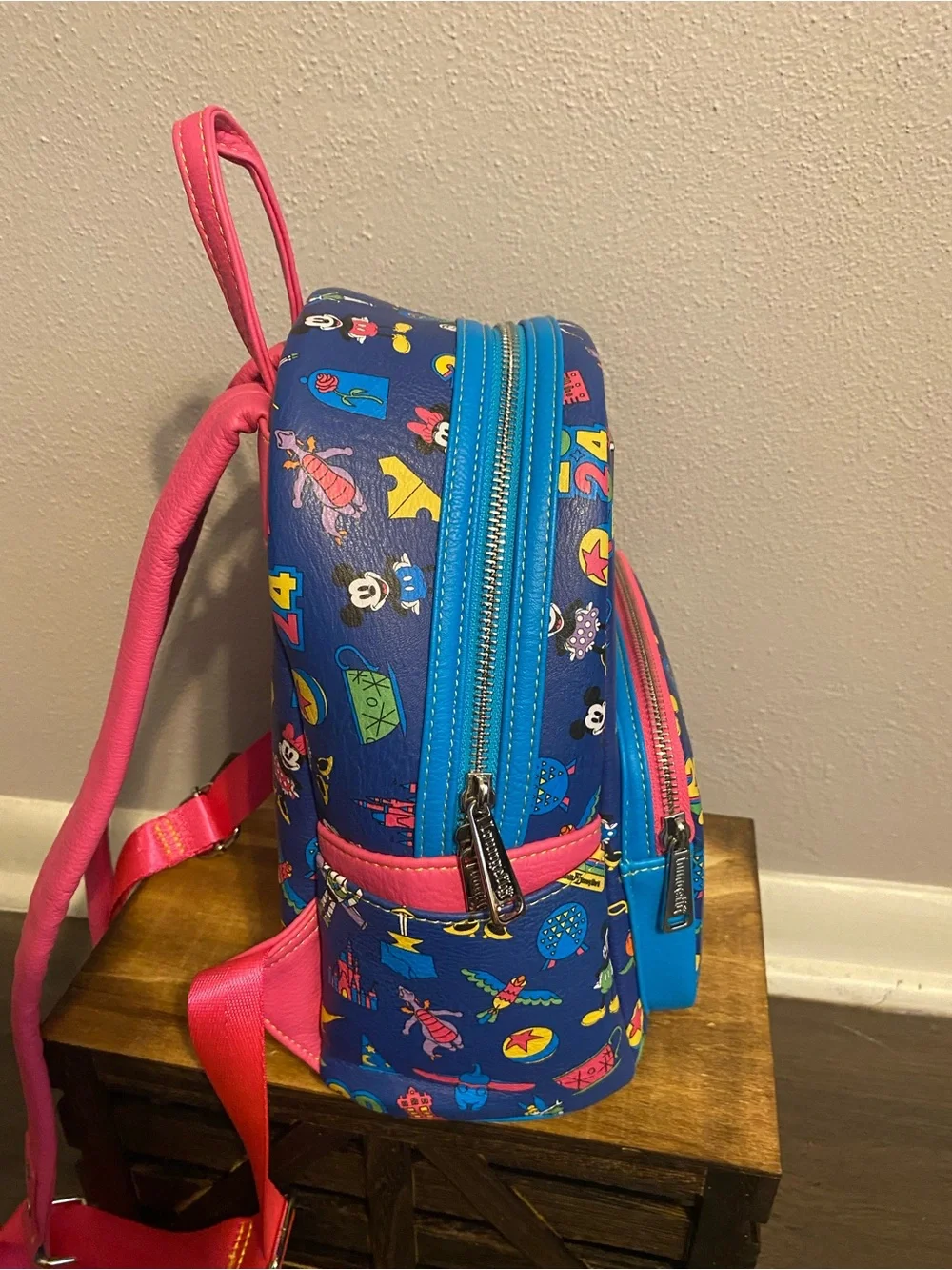 Loungefly Blue Mini Backpack with Pink Trim and Multicolor Disney Icons